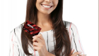 Young woman with credit card on grey background. Online shopping